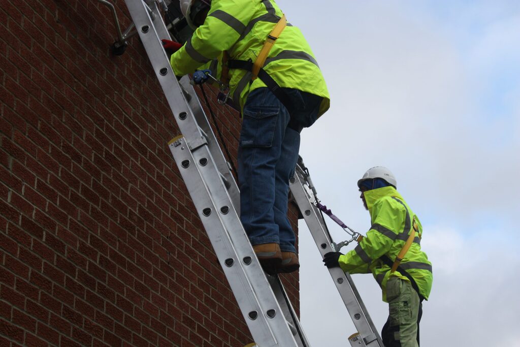 Engineer attached to a safety line and a cow tail
